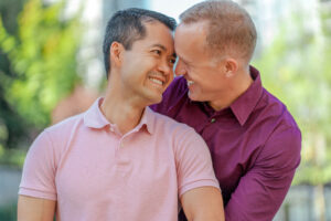 Image of gay male couple in NYC smiling